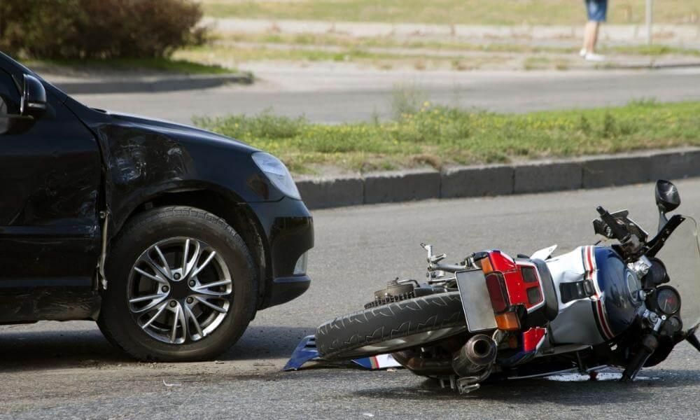 Motorcycle on the ground next to