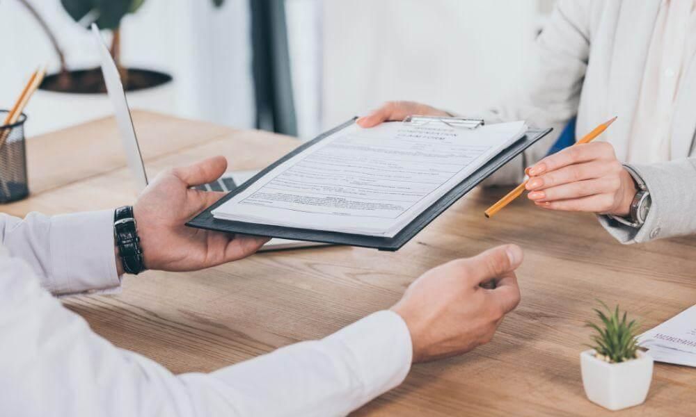 Two people reviewing documents with a Montana bad faith insurance