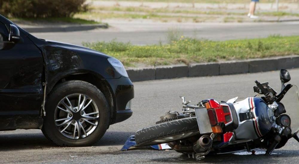 Motorcycle on the ground next to