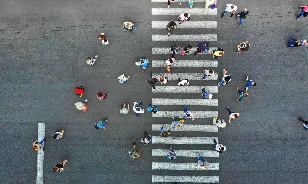 Group of people crossing a crosswalk, relevant to