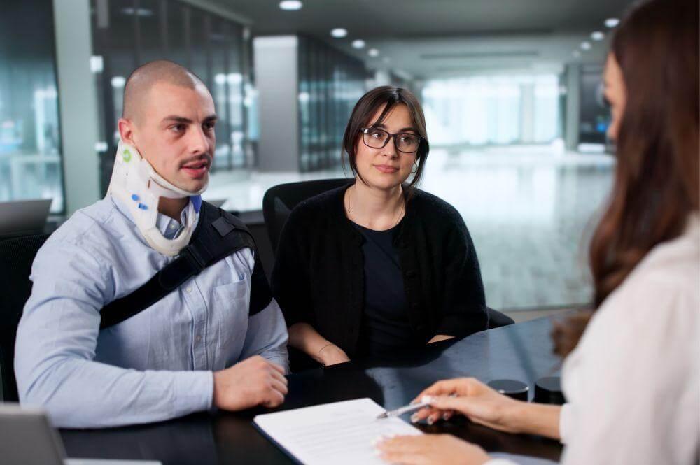 Man and woman discussing a truck accident lawsuit